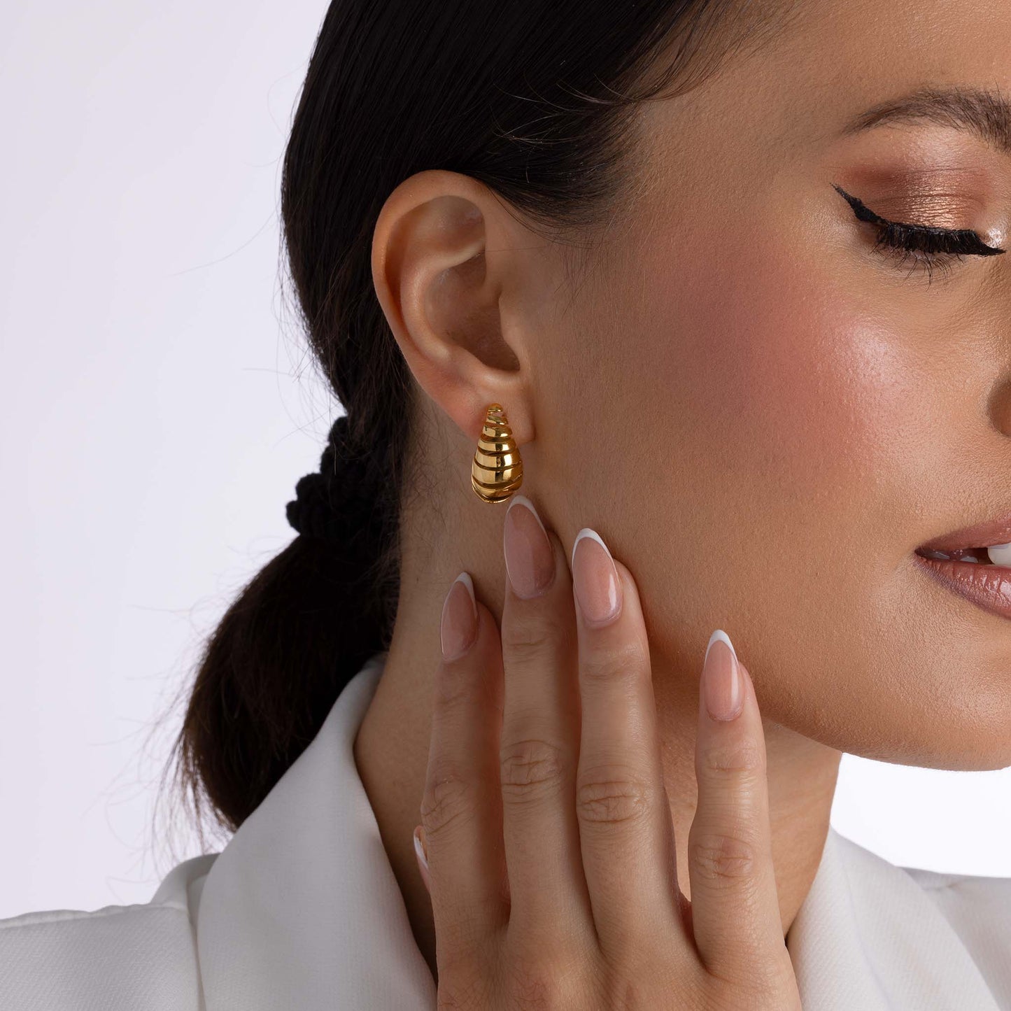 Gekrulde oorbellen goud